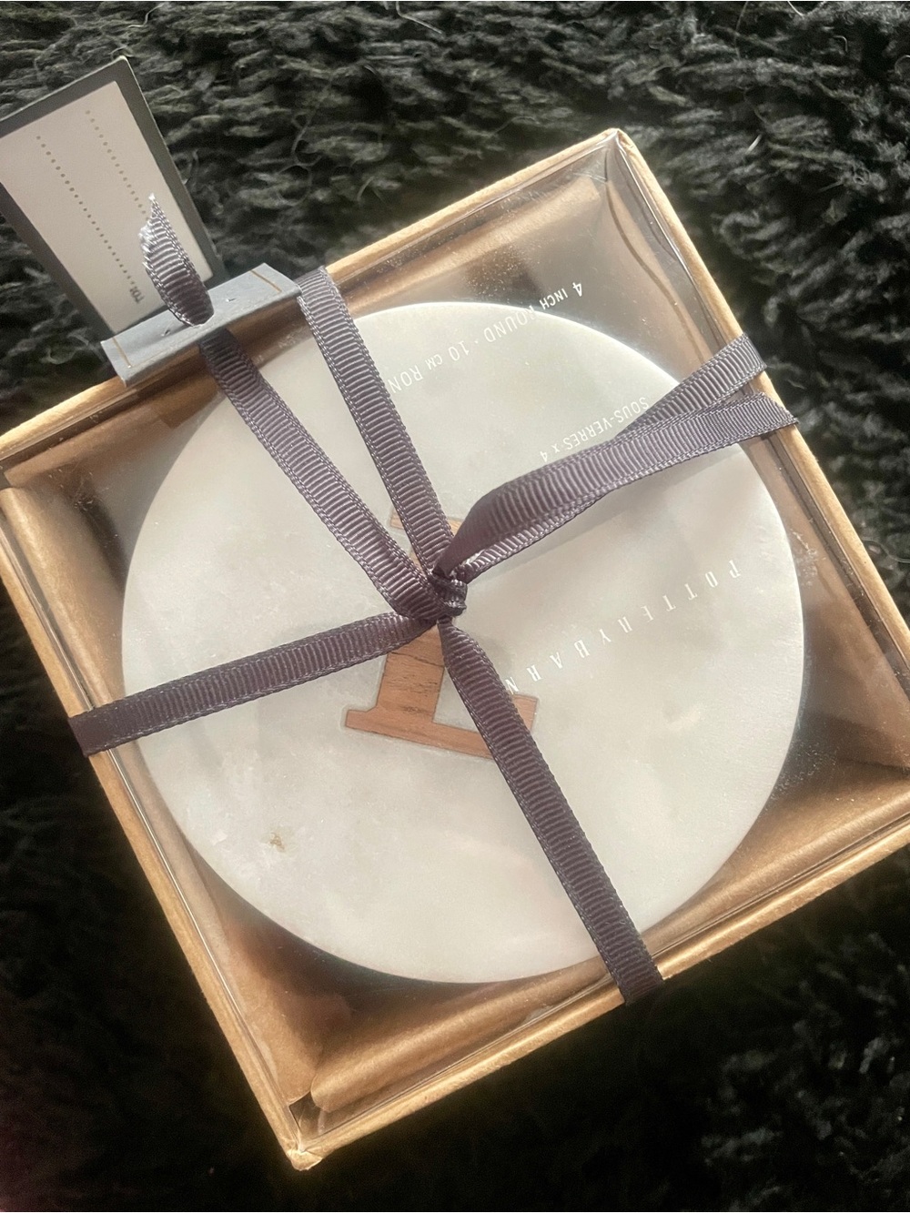 Pottery Barn Marble coaster with the initial “L”